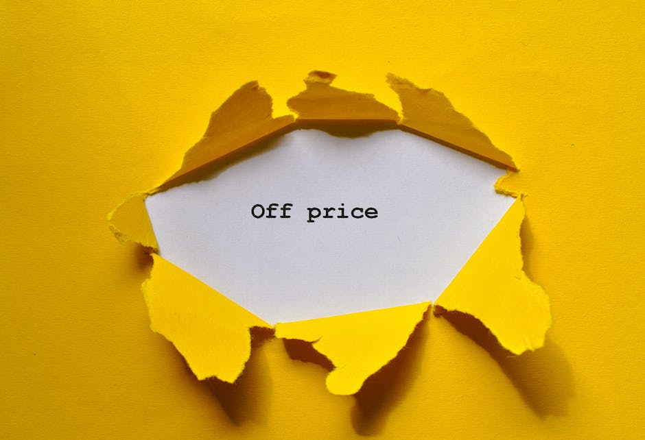 A torn yellow paper revealing a white surface underneath with the words 'Off price' typed in lowercase black font, set against a yellow background. The torn edges of the paper are irregular, and the lighting creates subtle shadows, emphasizing the layered effect. This image creatively conveys the concept of discounted or off-cost pricing, related to surface cleaning or deep cleaning offers by Carpet Cleaning Kingston, a professional cleaning company based in Kingston, as part of their cleaning service categories featured on their website.
